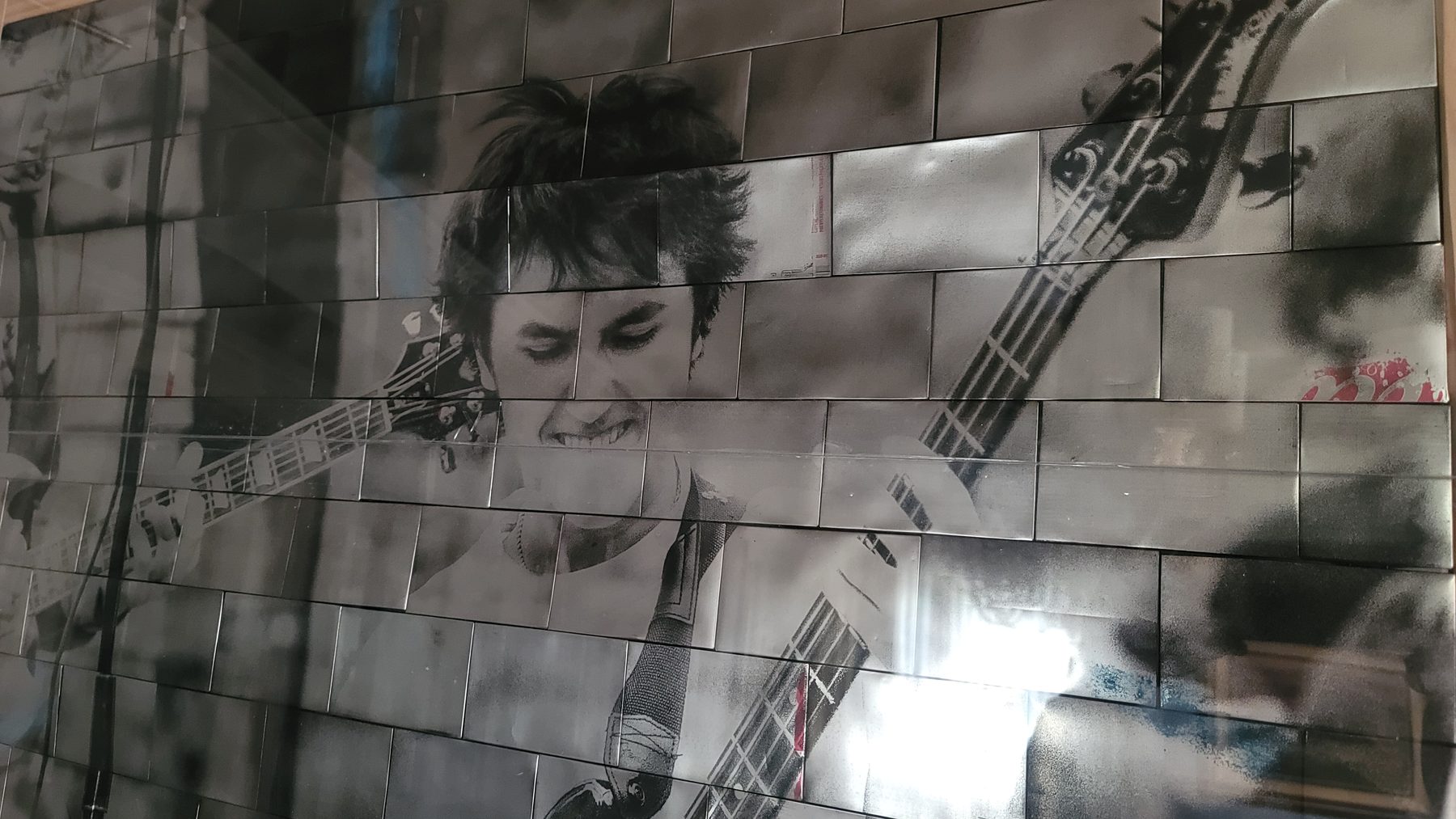 Close detail of a reclaimed aluminum mosaic portrait