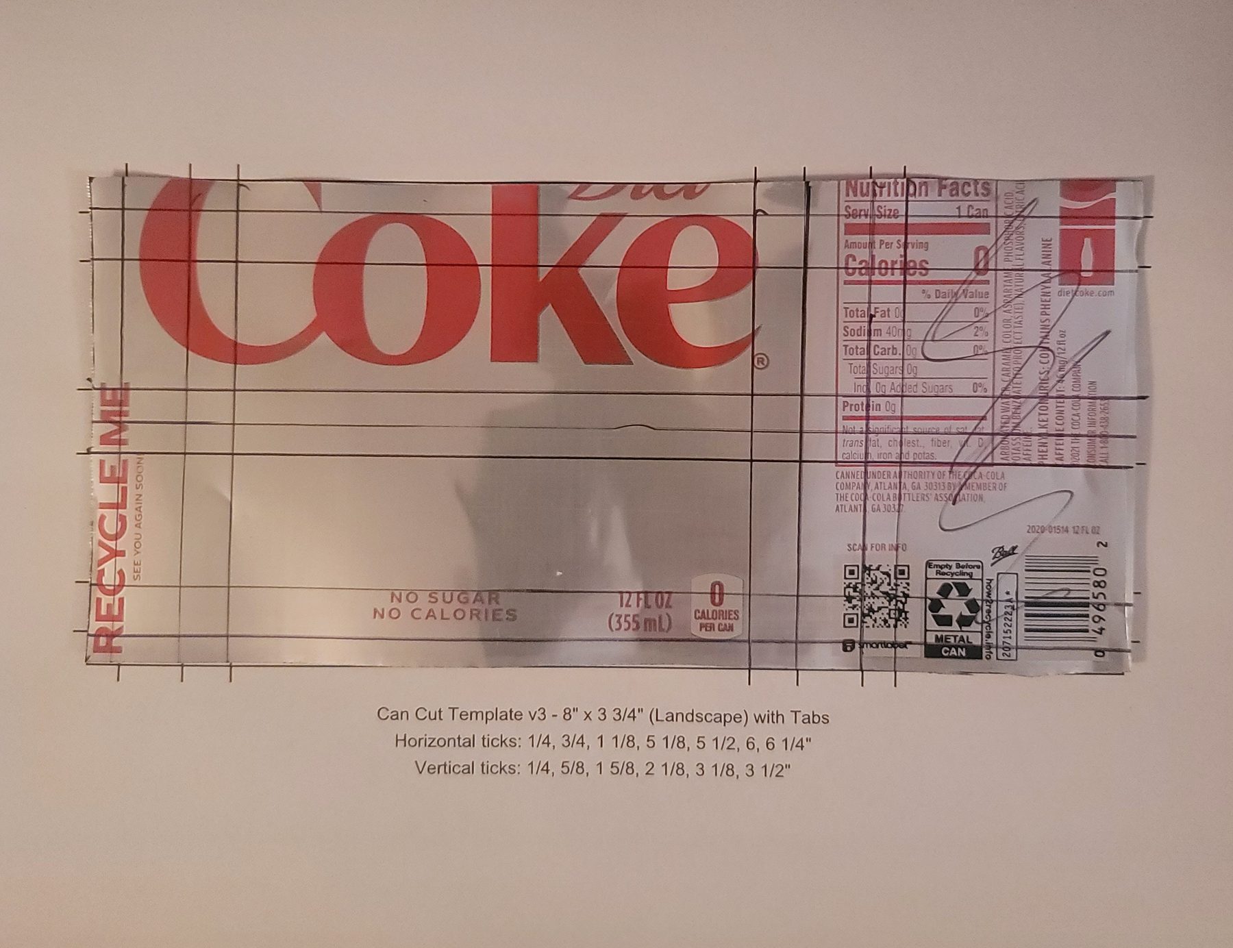 Cutting template placed over a Coke can aluminum sheet